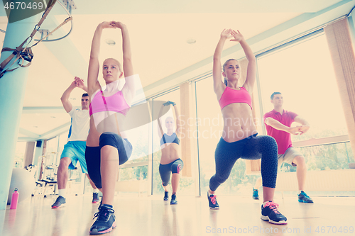 Image of group of  people working out in a fitness gym