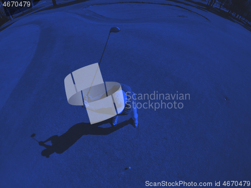 Image of top view of golf player hitting shot