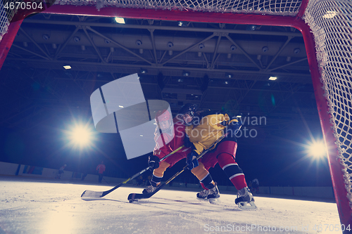 Image of teen ice hockey sport  players in action