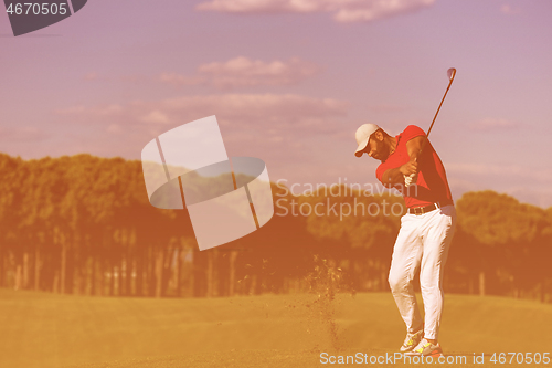 Image of golf player hitting long shot