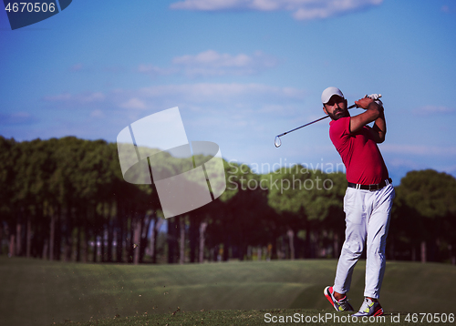 Image of golf player hitting long shot