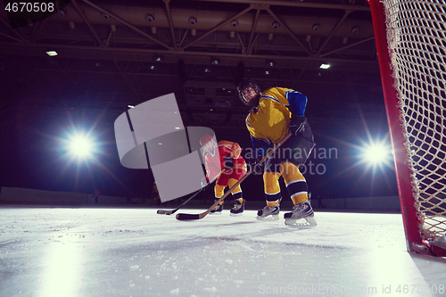 Image of teen ice hockey sport  players in action