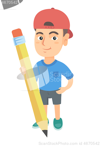 Image of Caucasian kid boy standing with a huge pencil.