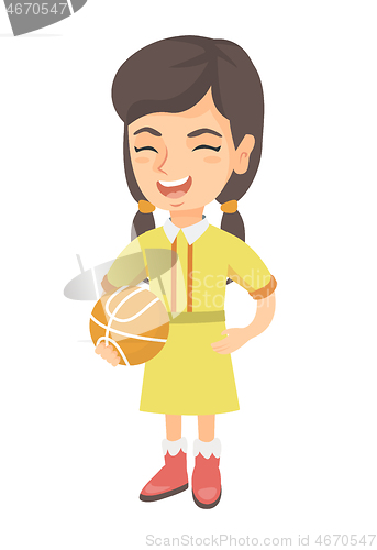 Image of Laughing schoolgirl holding a basketball ball.