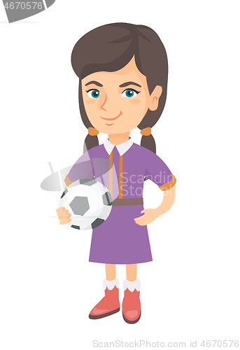 Image of Little caucasian girl holding a football ball.