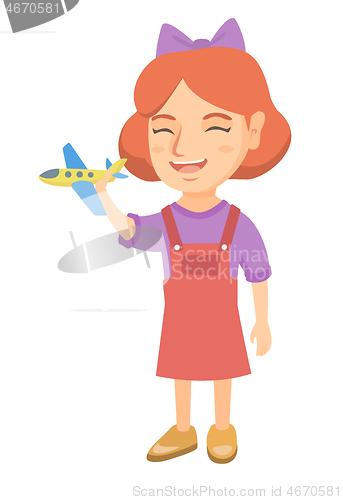 Image of Caucasian cheerful girl playing with toy airplane.