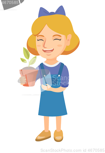 Image of Caucasian smiling girl holding a potted plant.
