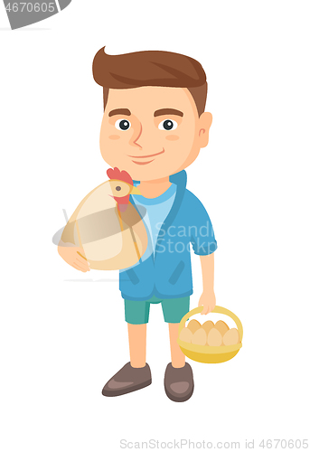 Image of Caucasian boy holding a chicken and hen eggs.