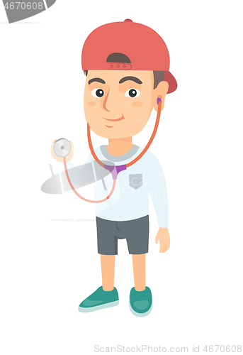 Image of Caucasian boy in doctor coat holding a stethoscope