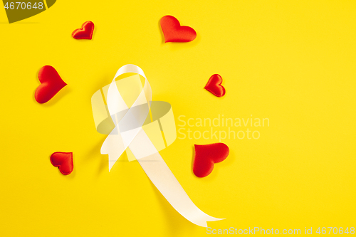 Image of lung cancer ribbon, white ribbon, a symbol of the fight against lung cancer