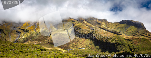 Image of volcano Taranaki covered in clouds, New Zealand 