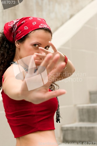 Image of woman hides her face by hands