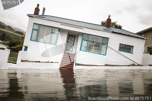 Image of Flooding with a crooked house