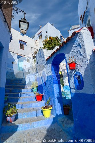 Image of Blue street with color pots in Chefchaouen