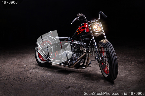 Image of Custom bobber motorbike in an workshop garage.