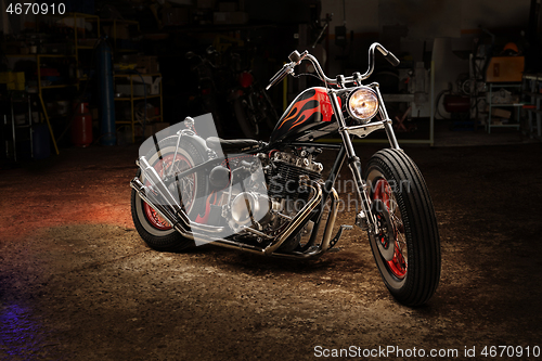 Image of Custom bobber motorbike in an workshop garage.