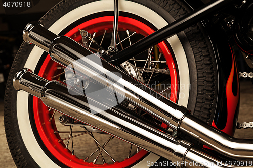 Image of Custom bobber motorbike in an workshop garage.