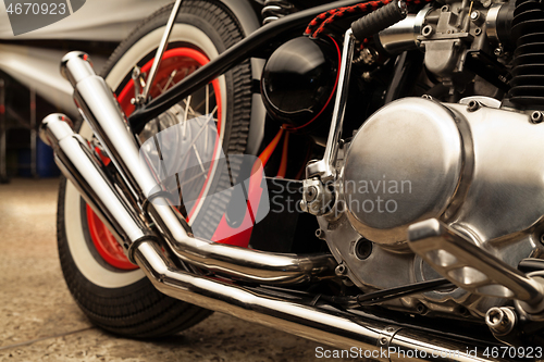 Image of Custom bobber motorbike in an workshop garage.