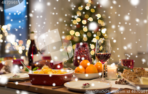 Image of food and drinks on christmas table at home