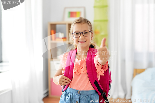 Image of student girl with school bag showing thumbs up