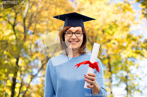 Image of happy senior graduate student woman with diploma