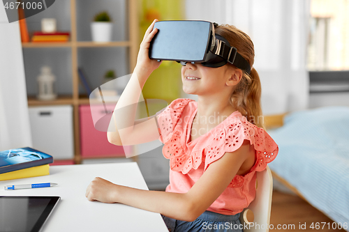 Image of girl in vr glasses at home