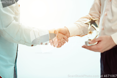 Image of Boss approving and congratulating young successful employee