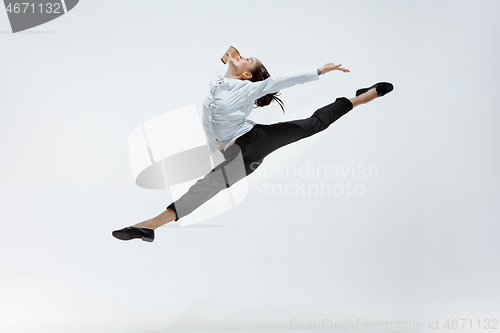 Image of Happy business woman dancing and smiling isolated on white.