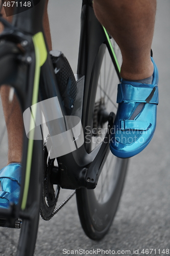 Image of triathlon athlete riding a bike on morning training