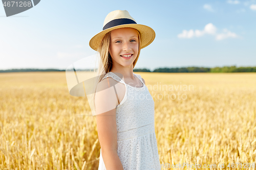 Image of portrait of girl in straw hat on field in summer