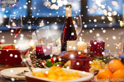 Image of food and drinks on christmas table at home