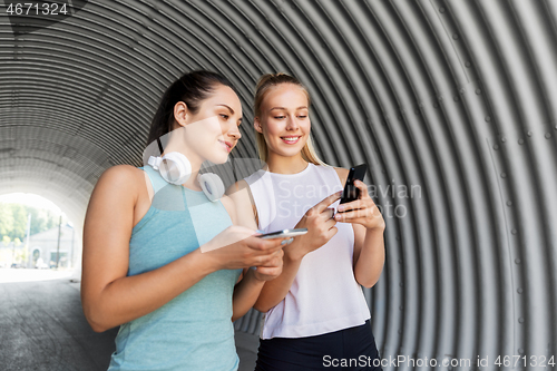 Image of women or female friends with smartphones