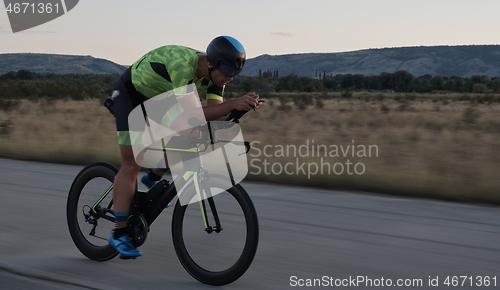 Image of triathlon athlete riding a bike