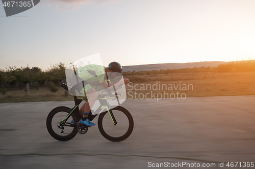 Image of triathlon athlete riding a bike