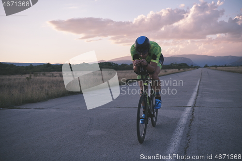 Image of triathlon athlete riding a bike