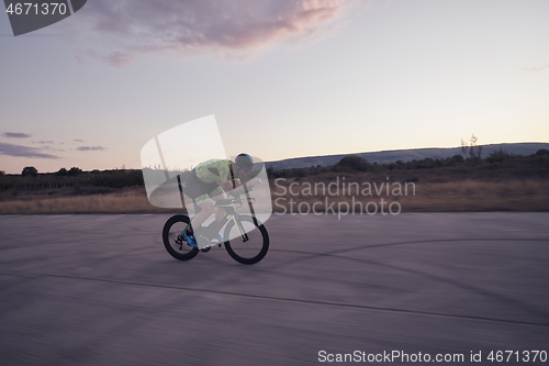 Image of triathlon athlete riding a bike