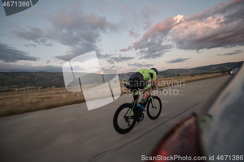 Image of triathlon athlete riding a bike