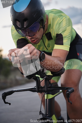 Image of triathlon athlete riding a bike