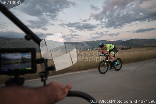 Image of triathlon athlete riding a bike