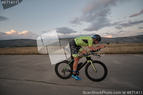 Image of triathlon athlete riding a bike