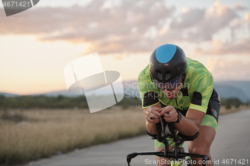 Image of triathlon athlete riding a bike