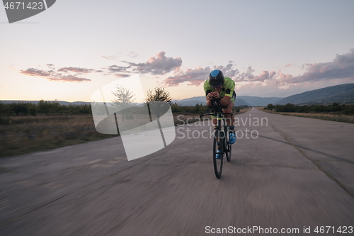 Image of triathlon athlete riding a bike