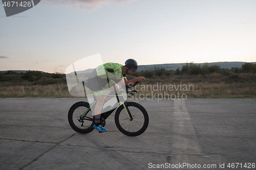 Image of triathlon athlete riding a bike