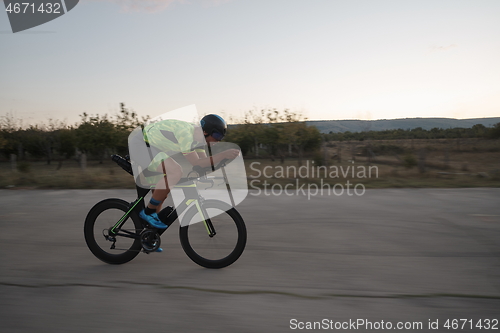 Image of triathlon athlete riding a bike