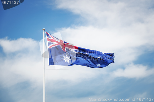 Image of australian national flag in front of the sky