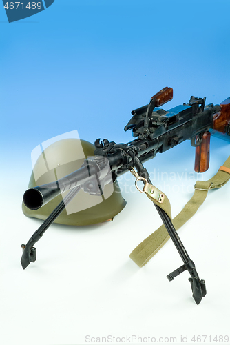 Image of Machine Gun And Flowers