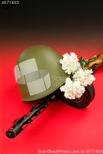 Image of Machine Gun And Flowers