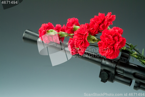 Image of Machine Gun And Flowers