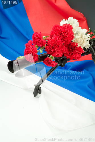 Image of Machine Gun And Flowers