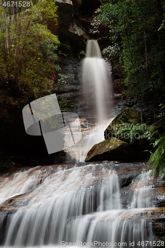 Image of Wonderful waterfall flowing from canyon into gorge